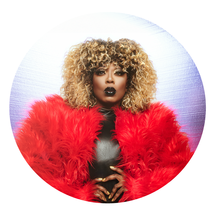 photo of bebe zahara benet wearing red fur with her hands around her waist