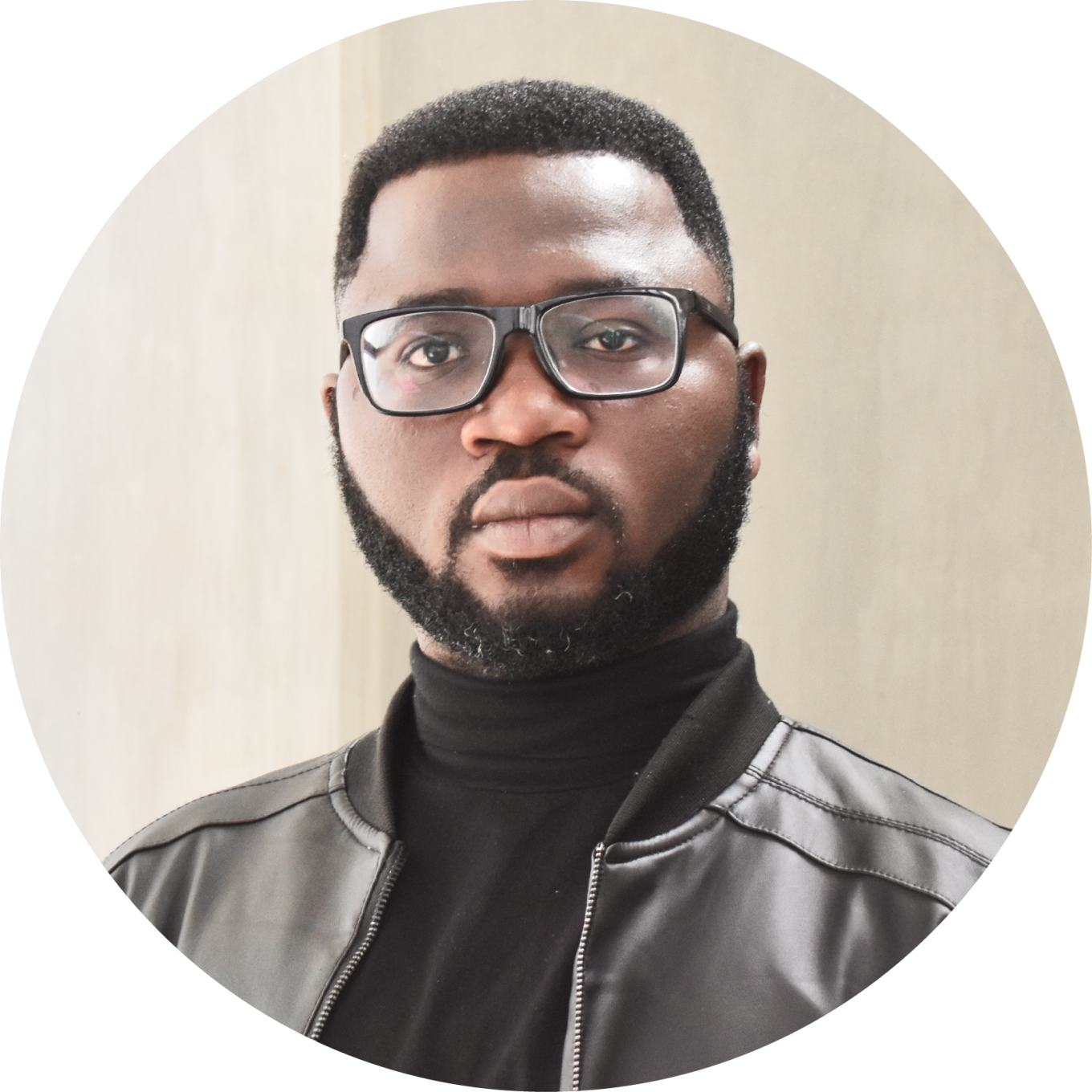 Dr Olayinka Atilola's headshot with black turtleneck and glasses